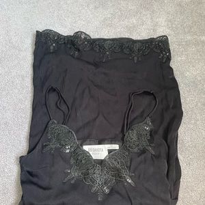 Thrifted black slip dress. Embellished on top and bottom. Size extra small.